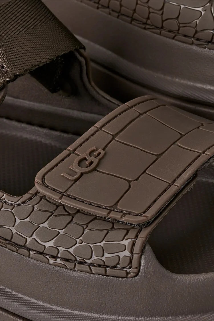 סנדלים בצבע שוקולד GoldenGlow Embossed UGG